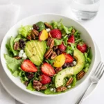 Easy Easter Spring Salad with Fruit in a white bowl on a wooden table