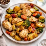 Sheet Pan Lemon Herb Chicken and Vegetables on a baking tray